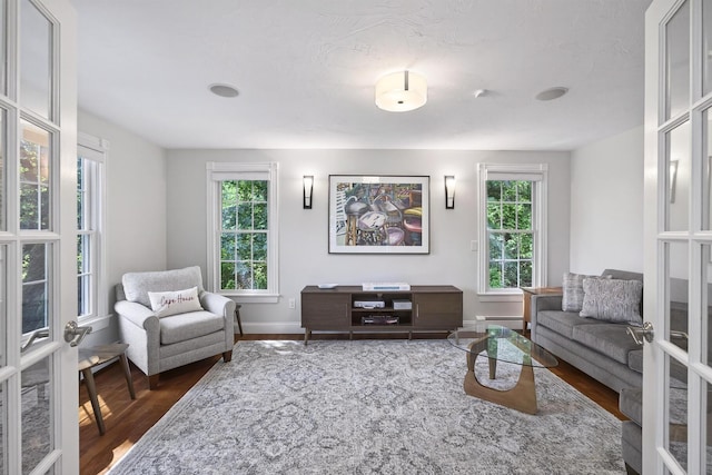 72 River Rd, Marstons Mills, MA 02648 - living area featuring baseboard heating, dark wood-style flooring, and plenty of natural light