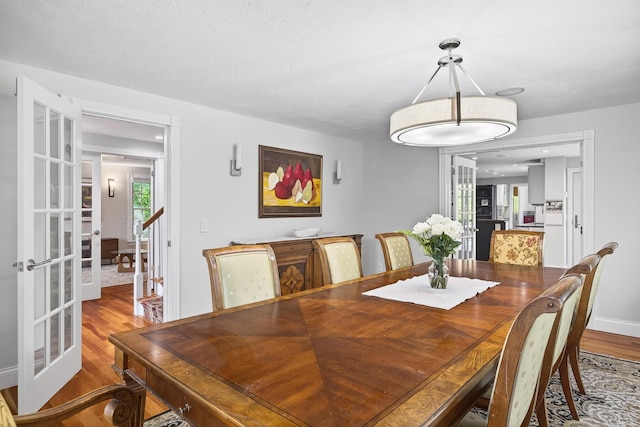 72 River Rd, Marstons Mills, MA 02648 - dining area featuring french doors and wood finished floors