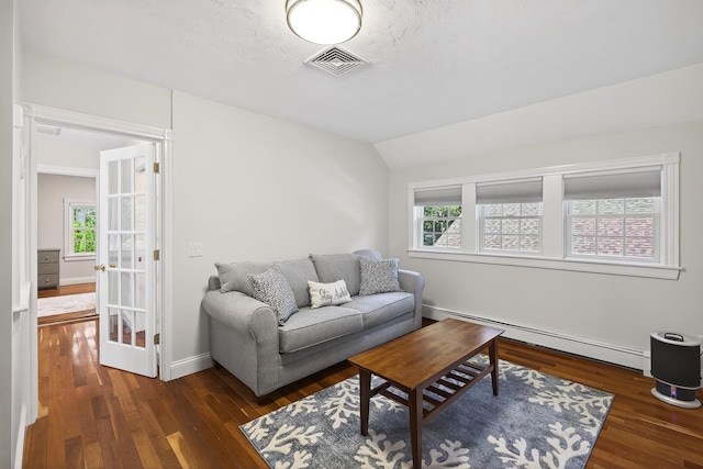 72 River Rd, Marstons Mills, MA 02648 - living room featuring a baseboard radiator, healthy amount of natural light, wood finished floors, and vaulted ceiling