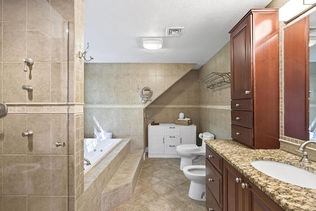 72 River Rd, Marstons Mills, MA 02648 - full bath featuring tile walls, vanity, a bidet, tile patterned flooring, and a garden tub