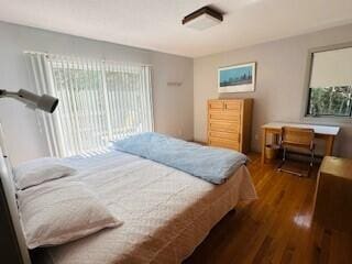 bedroom featuring dark hardwood / wood-style flooring