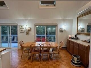 dining room featuring light parquet floors