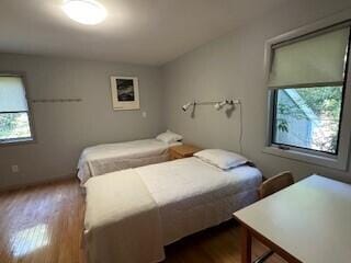 bedroom with wood-type flooring