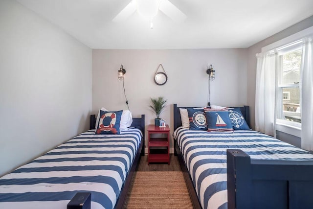 bedroom with wood finished floors and a ceiling fan
