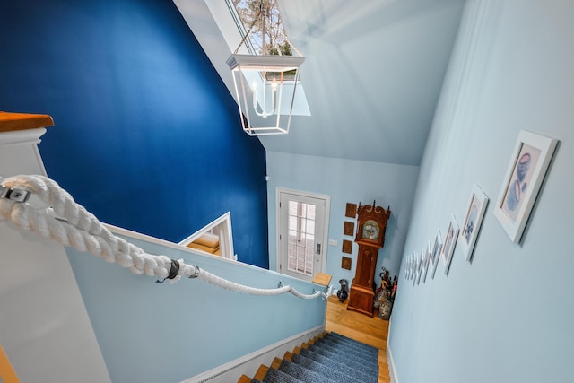 staircase featuring hardwood / wood-style flooring