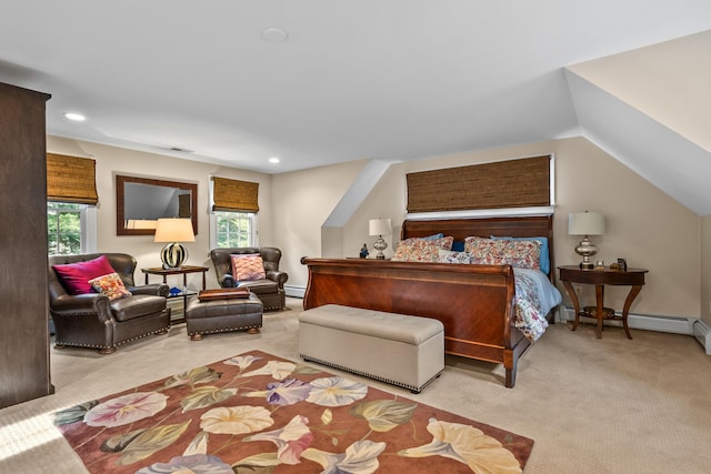 carpeted bedroom with lofted ceiling and a baseboard heating unit