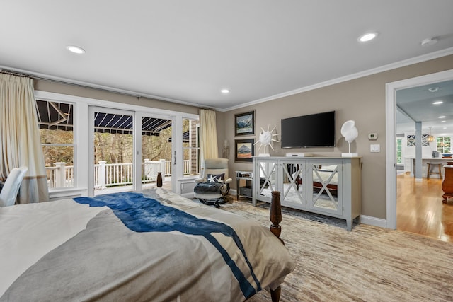 bedroom with crown molding, wood-type flooring, and access to exterior