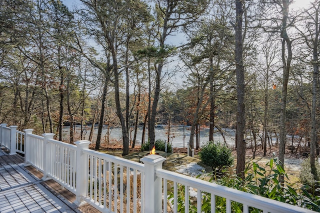 wooden deck featuring a water view