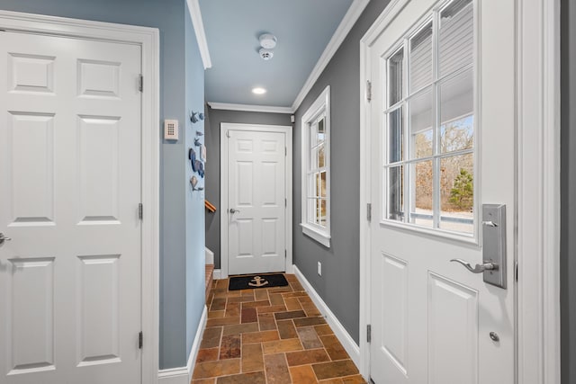 entryway featuring ornamental molding