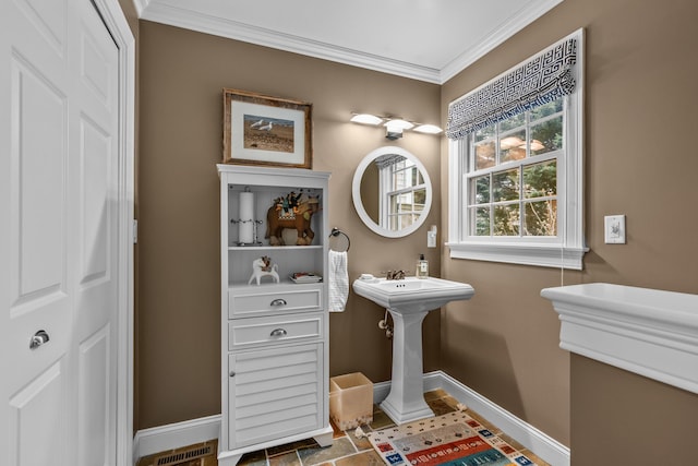 bathroom featuring ornamental molding