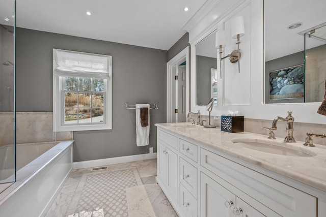 bathroom featuring vanity and a bathing tub