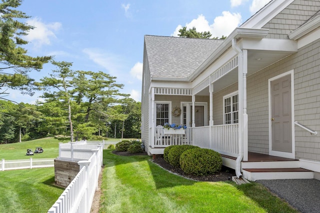 9 Sea Knoll Ct, Bourne, MA 02532 - view of side of property with a shingled roof and covered porch