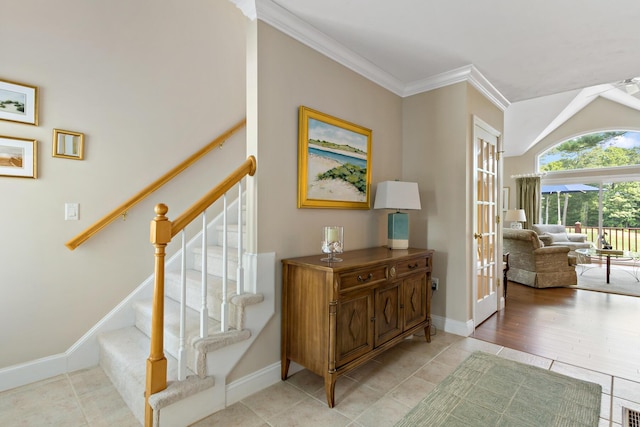 9 Sea Knoll Ct, Bourne, MA 02532 - stairway with french doors, tile patterned floors, ornamental molding, and lofted ceiling