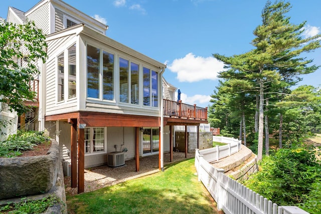 9 Sea Knoll Ct, Bourne, MA 02532 - rear view of house with a sunroom and a deck