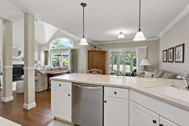 9 Sea Knoll Ct, Bourne, MA 02532 - kitchen featuring dishwasher, open floor plan, ornate columns, white cabinets, and ornamental molding