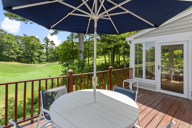 9 Sea Knoll Ct, Bourne, MA 02532 - deck with outdoor dining space, a yard, and view of scattered trees