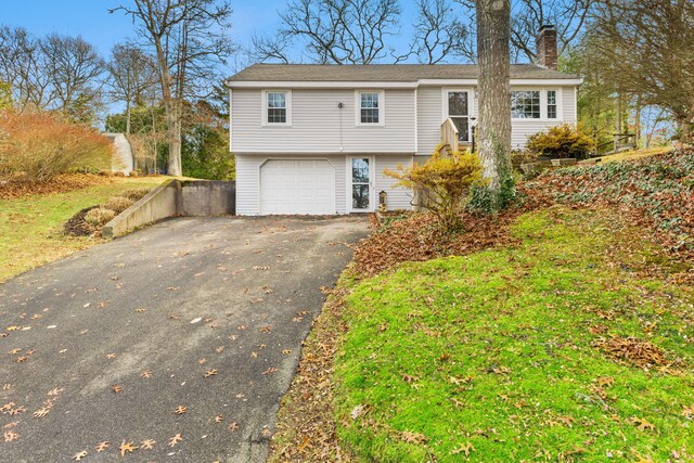 bi-level home featuring a garage