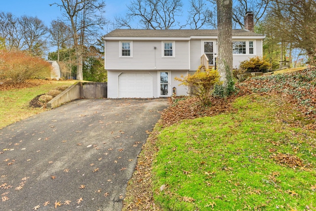 raised ranch featuring a garage