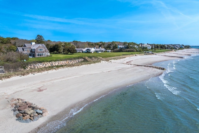 drone / aerial view featuring a view of the beach and a water view