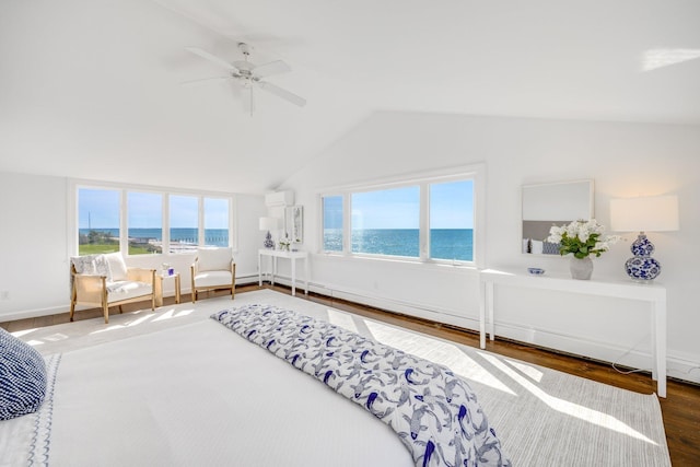 bedroom featuring lofted ceiling, baseboards, ceiling fan, a water view, and wood finished floors