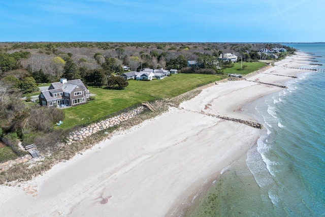 drone / aerial view with a beach view and a water view