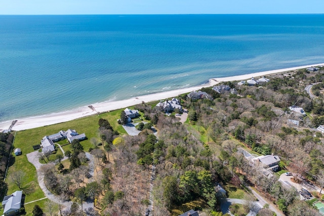 birds eye view of property featuring a view of the beach and a water view