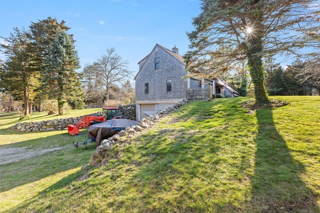 3 Bramblewood Ln, Orleans, MA 02653 - view of home's exterior featuring a lawn, a chimney, and a garage