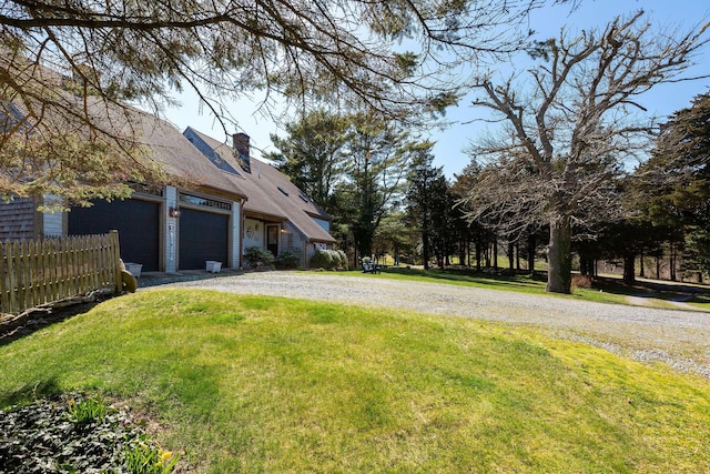 3 Bramblewood Ln, Orleans, MA 02653 - view of yard featuring fence, driveway, and a garage