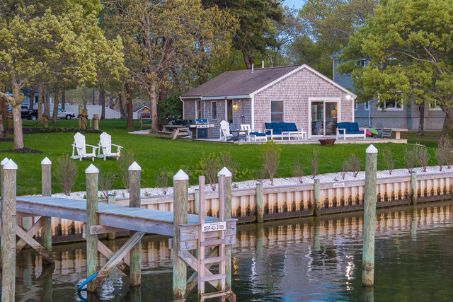 30 Overland Rd, Mashpee, MA 02649 - dock with a water view, a lawn, a patio area, and an outdoor hangout area