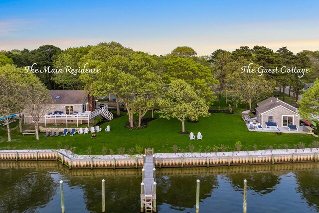 30 Overland Rd, Mashpee, MA 02649 - back of house with a water view and a lawn