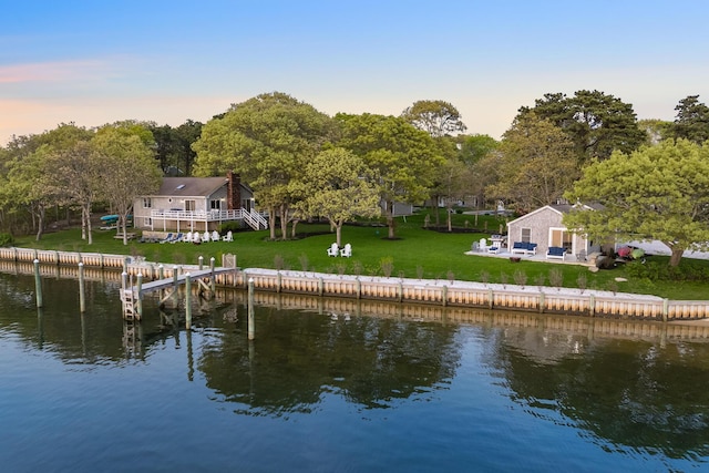 30 Overland Rd, Mashpee, MA 02649 - rear view of house featuring a water view and a yard