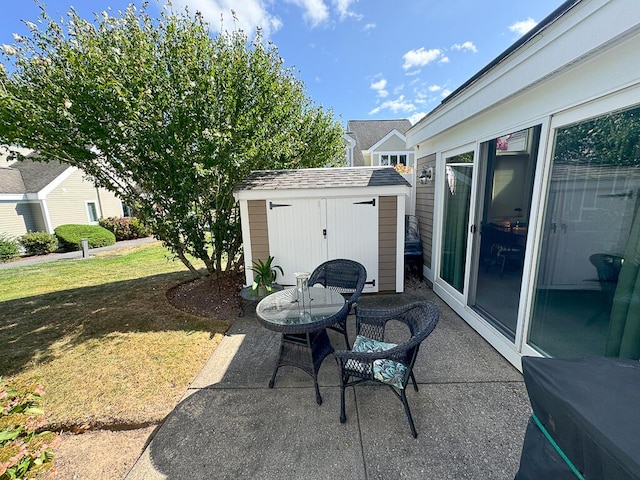 view of patio with a storage shed