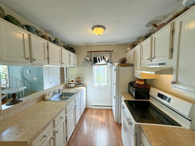 kitchen with light hardwood / wood-style floors, white cabinetry, a baseboard radiator, sink, and electric stove