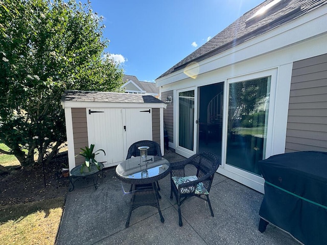 view of patio / terrace featuring a shed