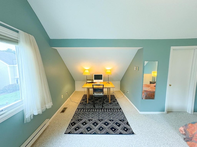 dining area featuring vaulted ceiling, carpet, and a baseboard radiator