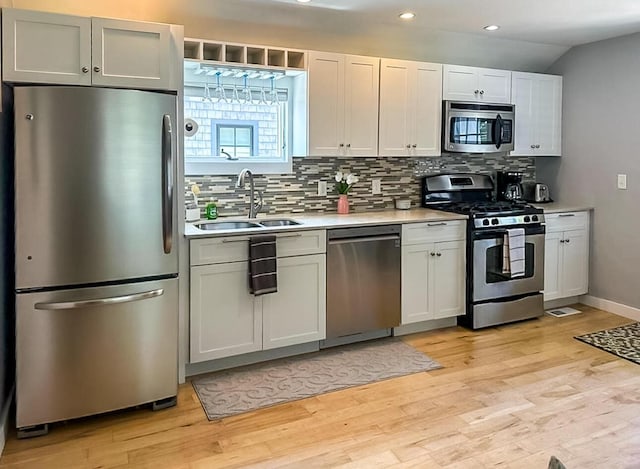 31 Northern Ave, Dennis Port, MA 02639 - kitchen with appliances with stainless steel finishes, a sink, light countertops, backsplash, and recessed lighting