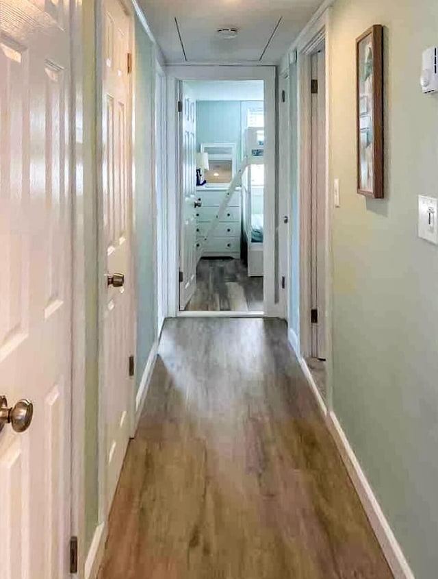 31 Northern Ave, Dennis Port, MA 02639 - hallway featuring wood finished floors, baseboards, and attic access