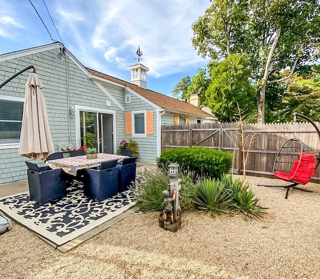 31 Northern Ave, Dennis Port, MA 02639 - rear view of property with fence and a patio area