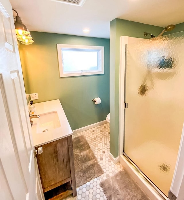31 Northern Ave, Dennis Port, MA 02639 - full bathroom featuring a stall shower, vanity, toilet, and baseboards