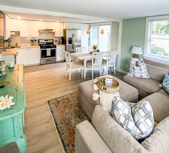 31 Northern Ave, Dennis Port, MA 02639 - living room with light wood finished floors, recessed lighting, and baseboards