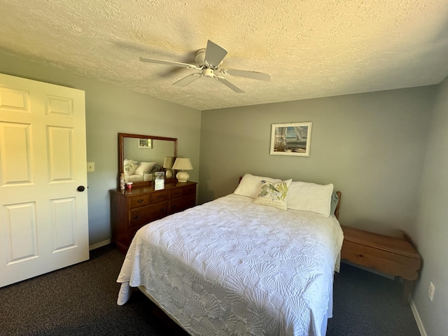 39 Pine Grove Rd, South Yarmouth, MA 02664 - bedroom with dark colored carpet, a textured ceiling, baseboards, and ceiling fan