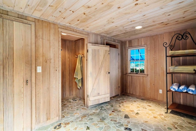 miscellaneous room featuring wood walls and wood ceiling