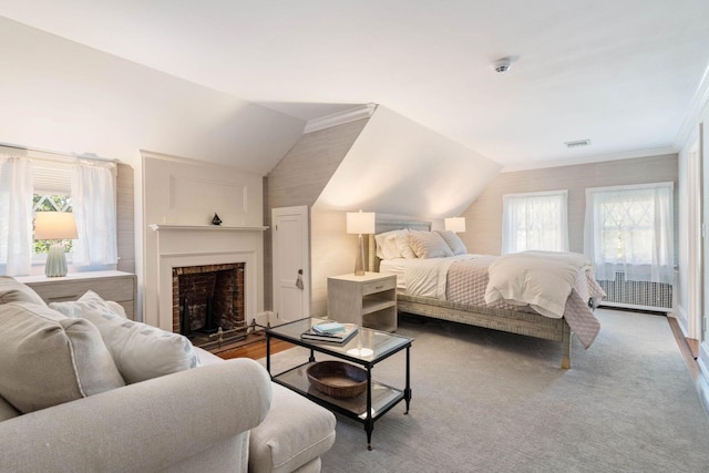 bedroom with access to outside, vaulted ceiling, and ornamental molding