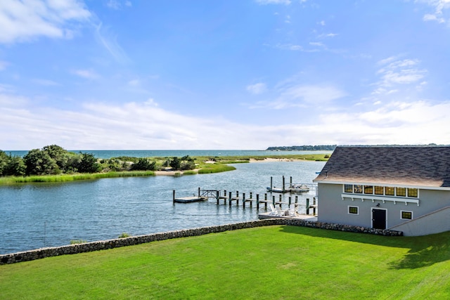 dock area featuring a water view and a yard