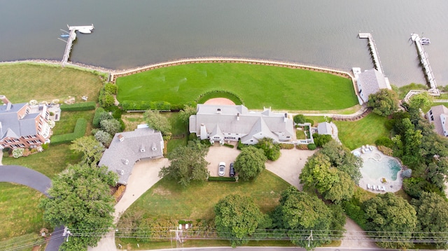 birds eye view of property with a water view