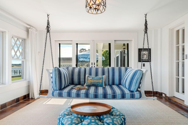 living room featuring a healthy amount of sunlight and french doors