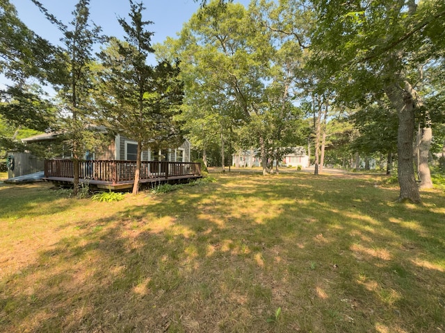 55 Lillian Rd, Eastham, MA 02642 - view of grassy yard with a deck
