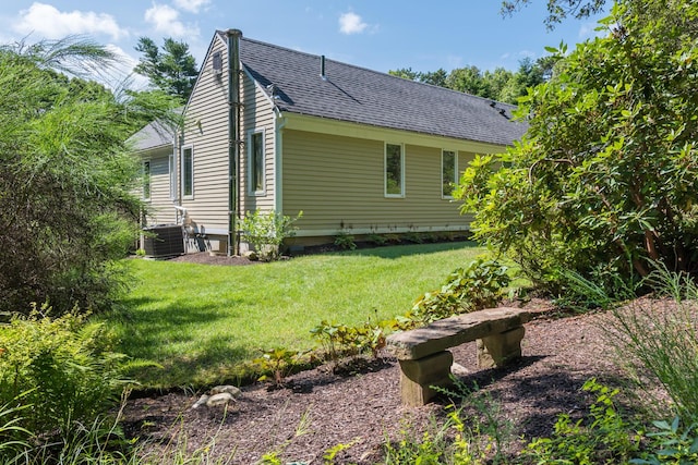139 Prince Ave, Marstons Mills, MA 02648 - view of side of property with roof with shingles and a yard