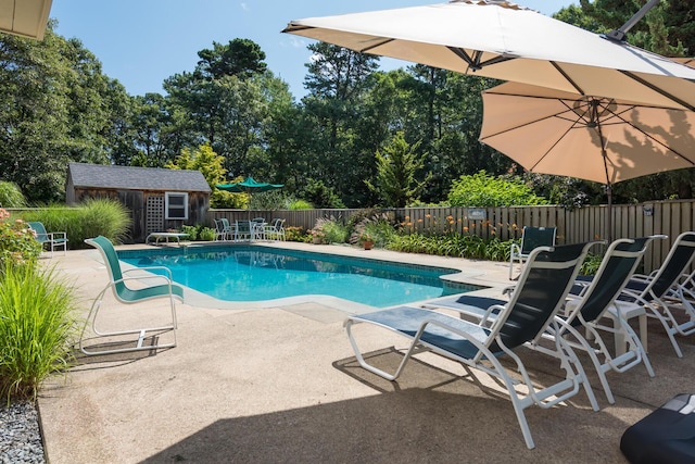 139 Prince Ave, Marstons Mills, MA 02648 - view of pool with a patio, an outbuilding, and view of scattered trees