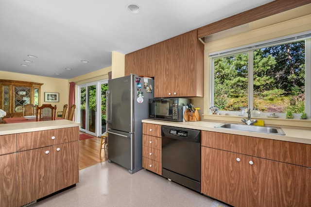 139 Prince Ave, Marstons Mills, MA 02648 - kitchen featuring black appliances, light countertops, recessed lighting, and brown cabinetry
